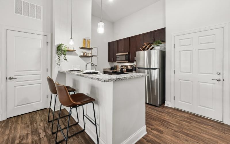 a kitchen with a table and chairs