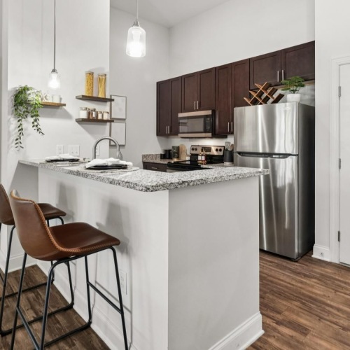 a kitchen with a table and chairs