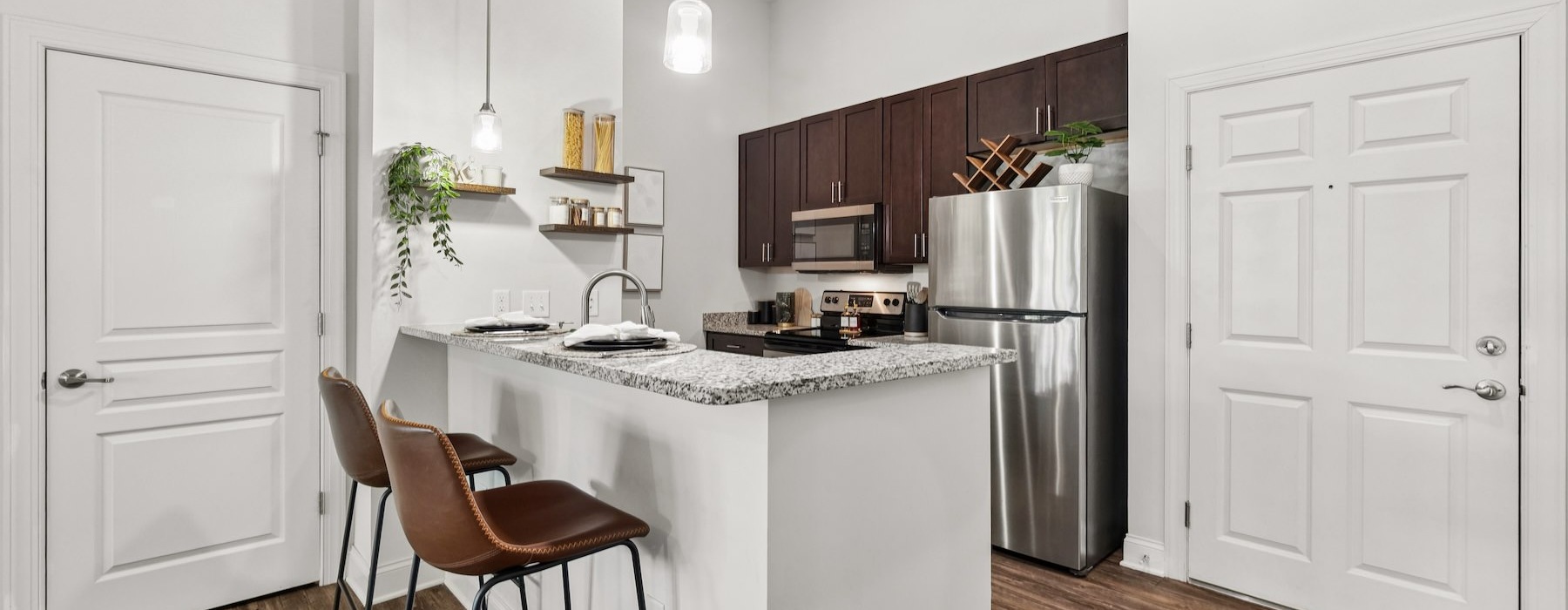 a kitchen with a table and chairs
