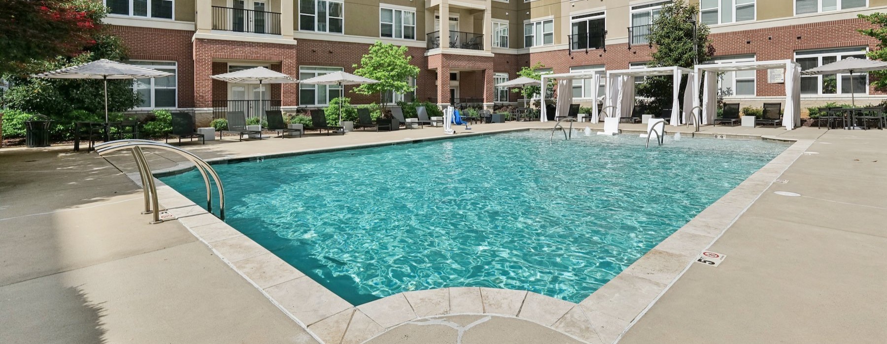 a swimming pool in front of a building
